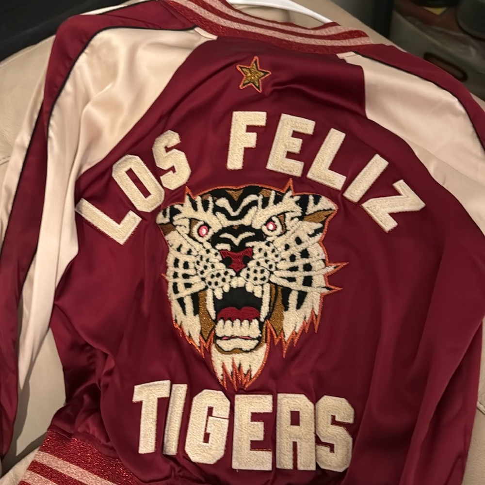 Maroon, tan with sparkly gold and maroon accents. Like new!